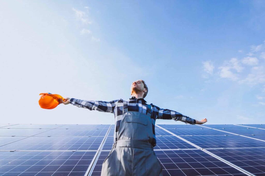 man worker in the firld by the solar panels 1 1536x1024 1